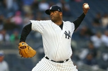 Baseball professional player, CC Sabathia throwing a ball