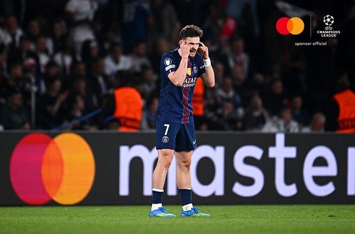 PSG player number 7 showing frustration on the pitch during UEFA Champions League semi-final first leg.