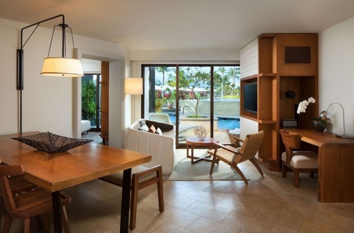 A dining area with a terrace view in one of the suites of the Andaz Maui at Wailea Resort.