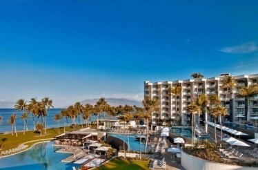 View at the beach front and a swimming pool area at the Andaz Maui at Wailea Resort.