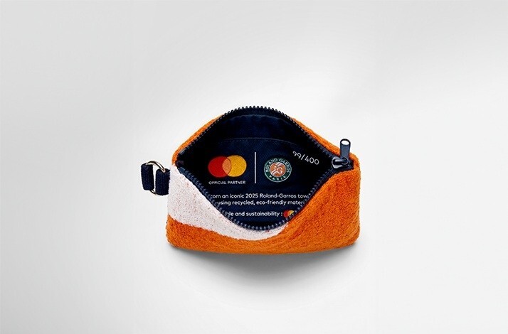 A pochette with Mastercard and Roland Garros logos printed inside.