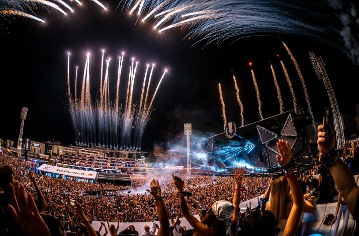 Large concert crowd with fireworks and bright stage lights at Ultra Europe in Split, Croatia.