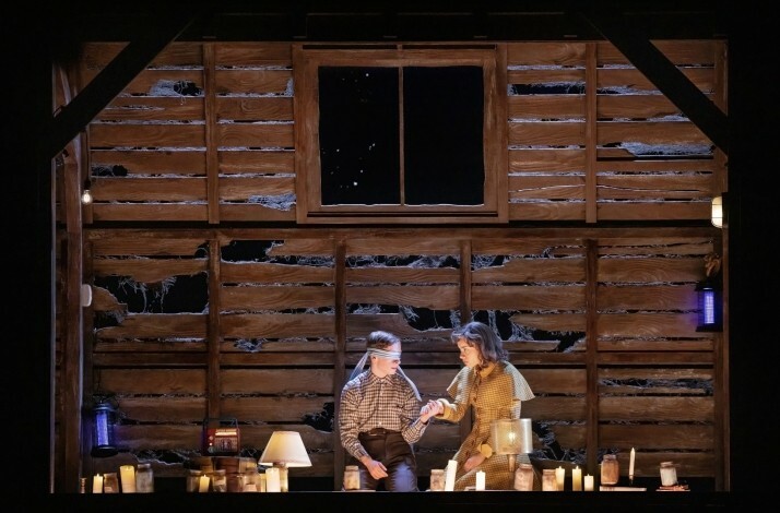 Scene from the Broadway's Stranger Things: The First Shadow performance: blindfolded boy holds a girl’s hand.