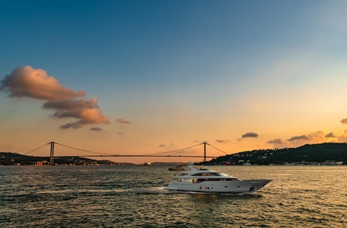 The elegant luxury yacht for a beautiful cruise along the Bosphorus on the sunset.