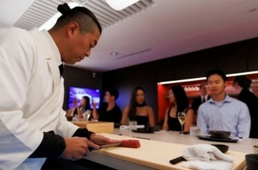 Sushi master Shimpei Raikuni cooking an omakase meal for AO 2026 guests