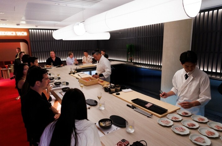 Chefs cook for visitors in the open kitchen at Rod Laver Arena in Melbourne.