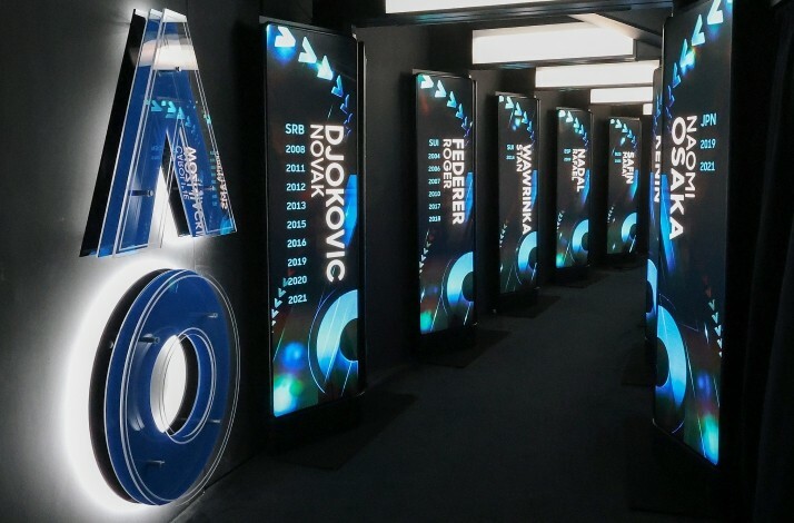 Hallway showcasing champion displays at Rod Laver Arena, Australian Open.