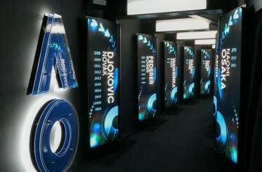 Hallway showcasing champion displays at Rod Laver Arena, Australian Open.