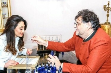 A participant smelling perfume at Le Studio des Parfums.