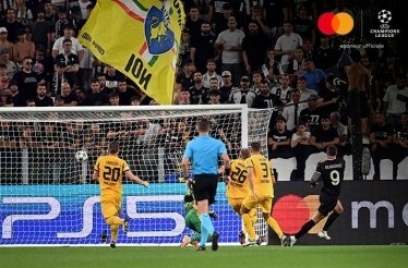 Juventus and Borussia Dortmund football players photographed during UEFA match.