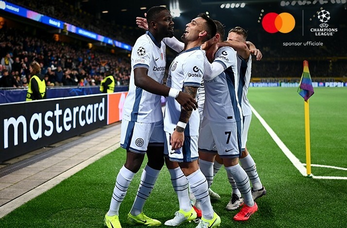 Football players celebrating during UEFA Champions League match