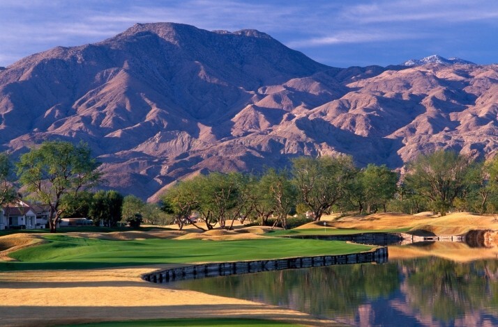 A view of the PGA West Nicklaus Tournament Course in La Quinta, California, featuring its signature water hazards and desert mountain backdrop.