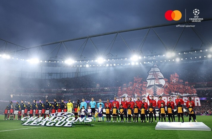 Pre-match lineup of players and UEFA Champions League Player Mascots. Mastercard and UEFA Champions League logos at the top right corner.