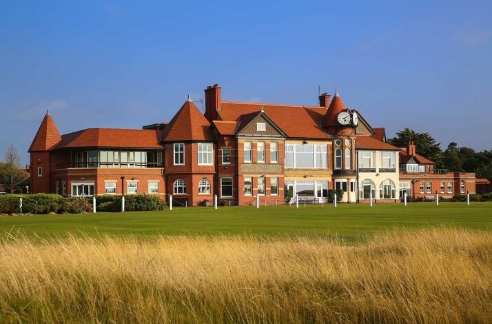 Royal Birkdale Golf Club, the clubhouse viewed from a grassy dune area.