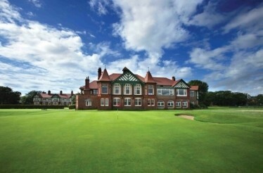 Royal Birkdale Golf Club, main clubhouse with a flag on the course.