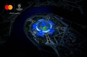 Bird's eye view at a football stadium. There is a joint logo of UEFA Champions League and Mastercard in the top left corner.