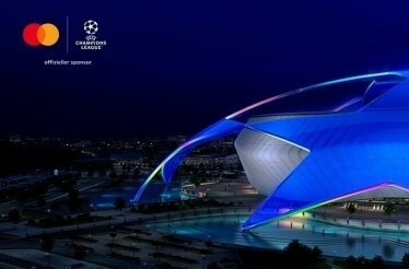 Bird’s-eye view at the football stadium. There is a joint logo of UEFA Champions League and Mastercard in the top left corner.