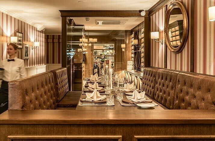 Dinner table served for eight people at Little London steakhouse in Munich.