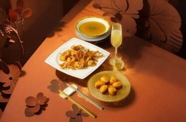 Three meals made by chef of restaurant YUÈ neatly put on a table