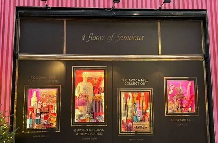 Entrance of Avoca's flagship Suffolk Street store in Dublin, showcasing colorful window displays.