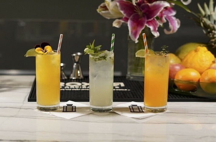 Three glasses of tropical cocktails made with ROXOЯ Spirits.