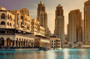 The view on building and a pond in Dubai