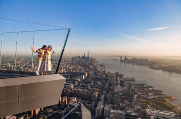 Couple at Edge observation deck, 30 Hudson Yards, New York City.