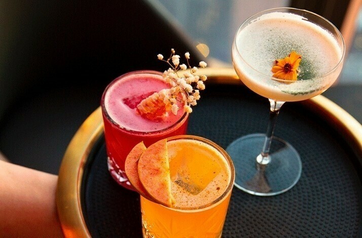 A tray of cocktails served at Peak with Priceless