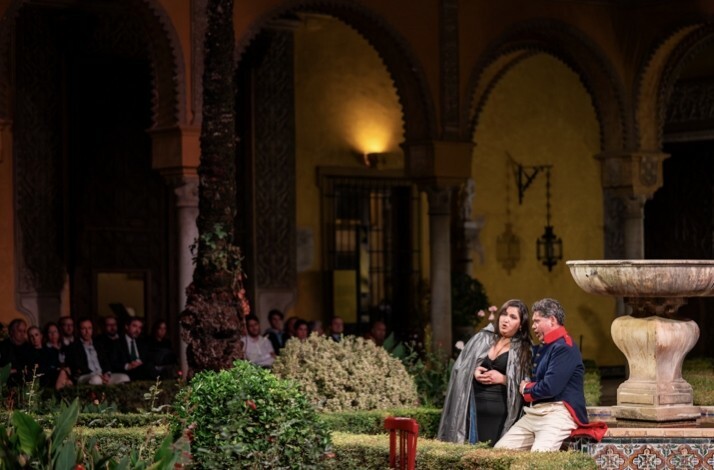 Actors on stage performing a staged version of Carmen in the breathtaking courtyard of Palacio de las Dueñas.