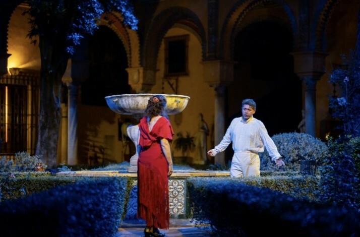 Actors on stage performing a staged version of Carmen in the breathtaking courtyard of Palacio de las Dueñas.