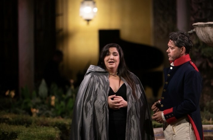 Actors on stage performing a staged version of Carmen in the breathtaking courtyard of Palacio de las Dueñas.