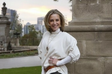Author and historian Elisa Queijeiro smiling on camera.