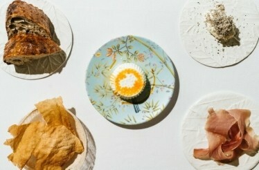 Five dishes beautifully served and displayed on the table.