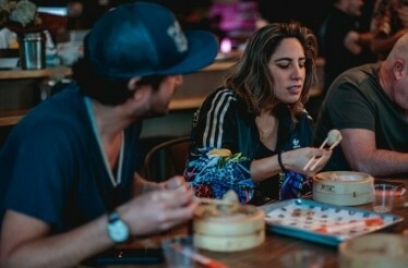 A couple enjoying the dishes of Phoenix restaurant.