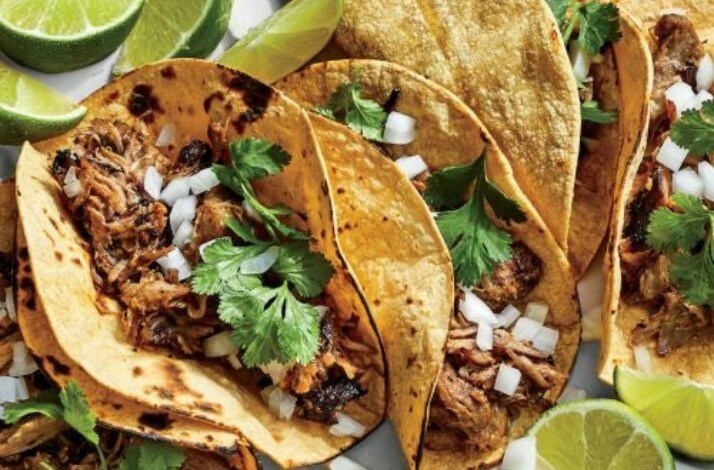 Tacos with meat, onion and veggetables inside