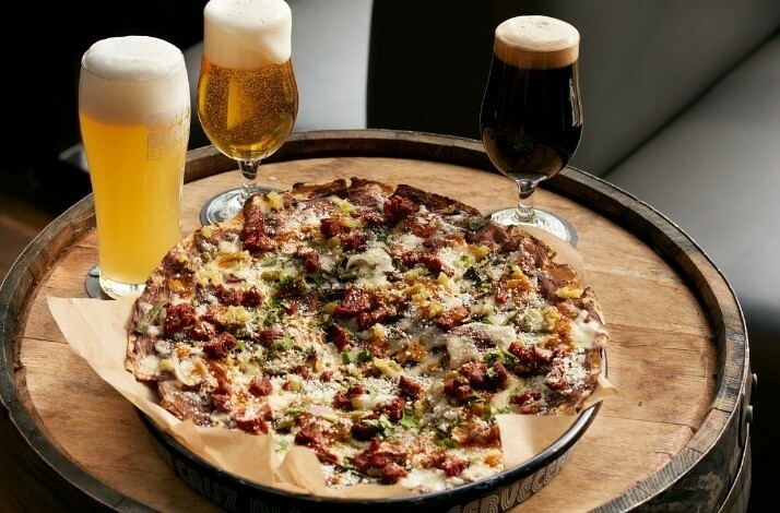 A plate with a pizza with pints