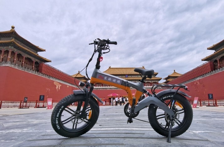 Power assisted cycle parked in front of the Forbidden City in Beijing.