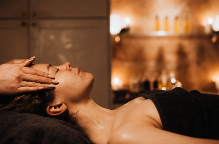 A  masseur is performing the facial massage on the lady at the Rena Spas