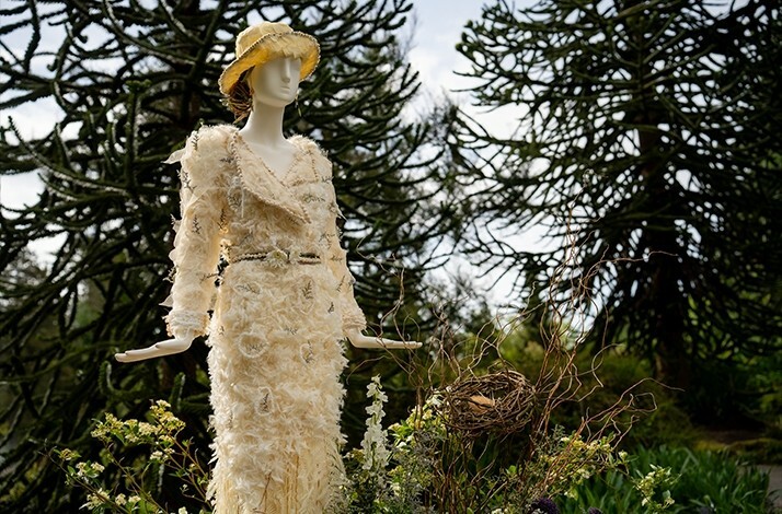 A figure in a white dress made out of flowers at the Fleurs de Villes Downton Abbey exhibition