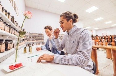 Two men are smelling the created parfume at the  Maison de Parfums Galimard
