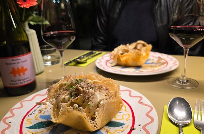 Two plates and a bottle of wine 