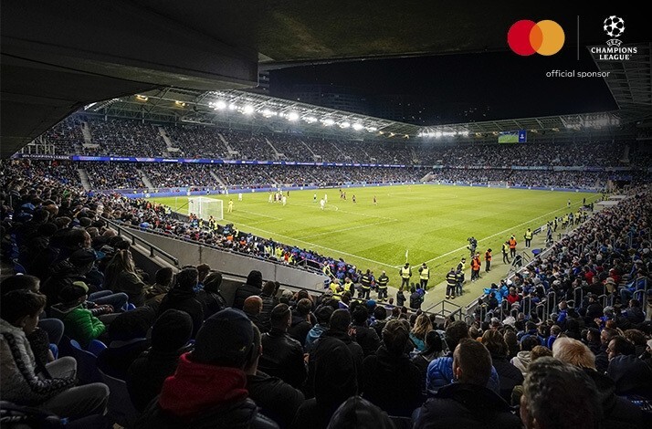 A view of the football pitch from the stands. Mastercard and UEFA logos at the top right corner.