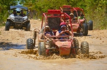 A group of people on a guided off-road buggy tour of Punta Cana 