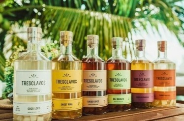Colorful bottles of award-winning Tres Clavos rum produced at at San Juan Artisan Distillers