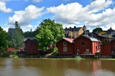 A scenic view of the Porvoo Old Town lake and buildings at Helsinki.