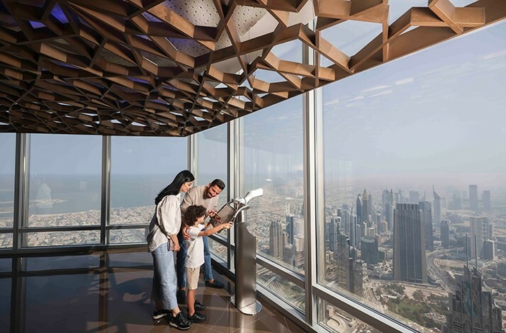 Parents and son enjoy the views from At the Top, Burj Khalifa.