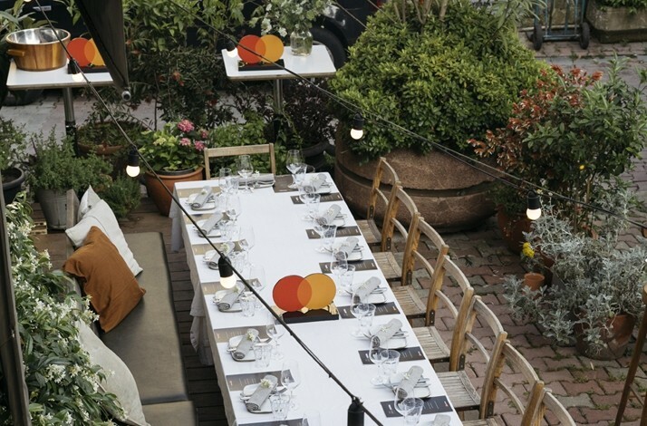 Large dinner table served for a curated dinner at Apartıman Yeniköy restaurant in Istanbul.