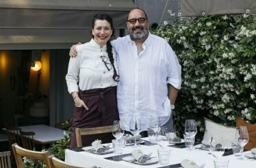 Chef Burçak Kazdal and wine expert Levon Bağış posing for a photograph.