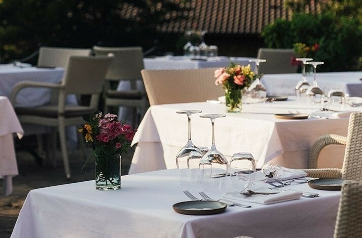 Table settings with flowers and upturned glasses at Casa Lavanda.