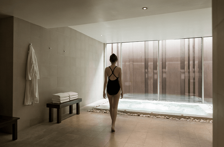 A girl enters the steam and hydro pool at Como Shambhala Metropolitan Bangkok.